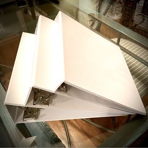 Brand new white D-ring style binders.